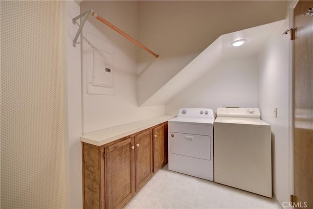 laundry area featuring washing machine and dryer and electric panel