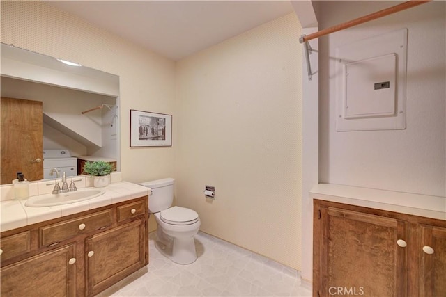 full bath with electric panel, vanity, and toilet