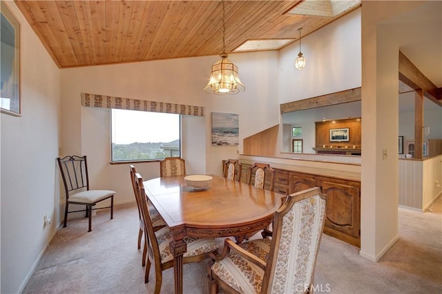 dining room with light carpet, wooden ceiling, baseboards, and a notable chandelier