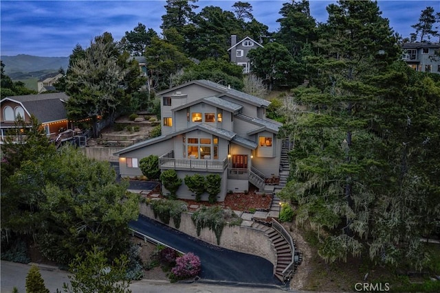 view of front of home featuring stairs and a mountain view