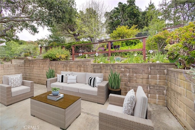 view of patio / terrace with fence and an outdoor living space