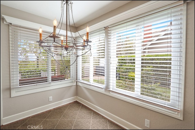 23962 Lanteen Cir, Laguna Niguel, CA 92677 - unfurnished dining area featuring a chandelier and baseboards