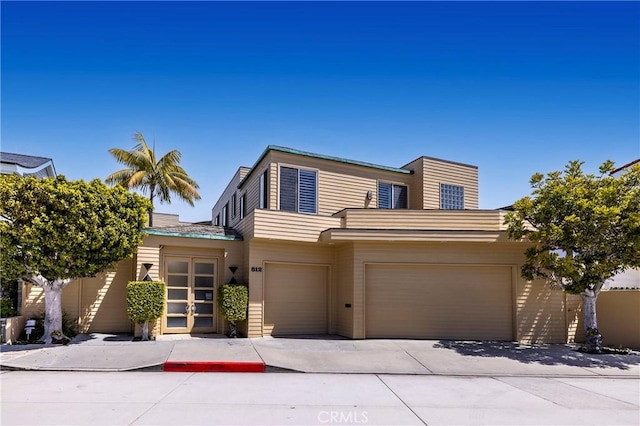 812 W Bay Ave, Newport Beach, CA 92661 - view of front facade with an attached garage and concrete driveway
