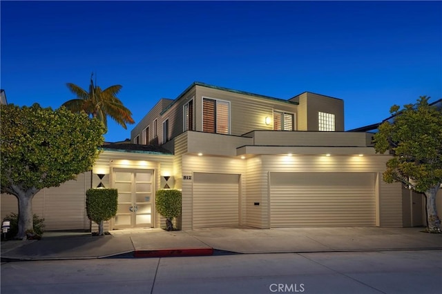 812 W Bay Ave, Newport Beach, CA 92661 - view of front of home featuring concrete driveway and a garage