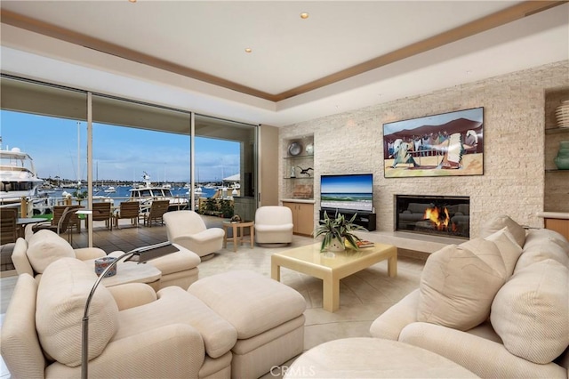 812 W Bay Ave, Newport Beach, CA 92661 - living area featuring a wealth of natural light, built in shelves, and a fireplace