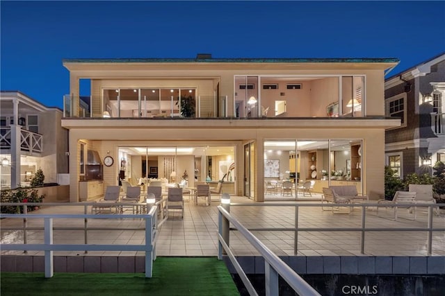 812 W Bay Ave, Newport Beach, CA 92661 - back of house at night with an outdoor hangout area