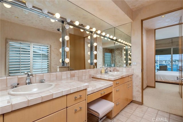 812 W Bay Ave, Newport Beach, CA 92661 - full bathroom with plenty of natural light, baseboards, tile patterned floors, vanity, and connected bathroom