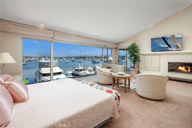 812 W Bay Ave, Newport Beach, CA 92661 - carpeted bedroom with lofted ceiling, a water view, and a glass covered fireplace