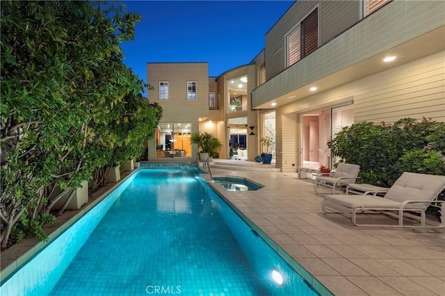 812 W Bay Ave, Newport Beach, CA 92661 - pool at night with a pool with connected hot tub and a patio area