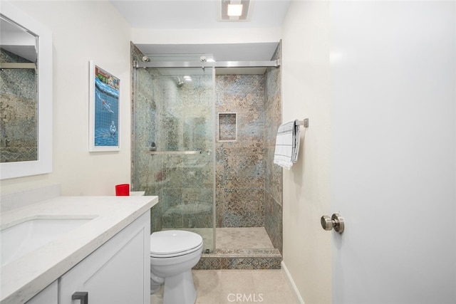full bathroom with a shower stall, tile patterned floors, vanity, baseboards, and toilet