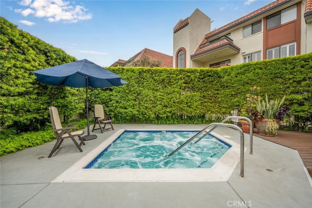view of pool featuring a community hot tub