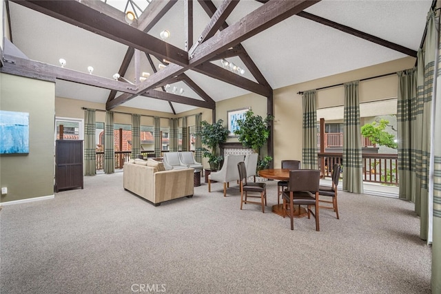 sunroom featuring beam ceiling and plenty of natural light