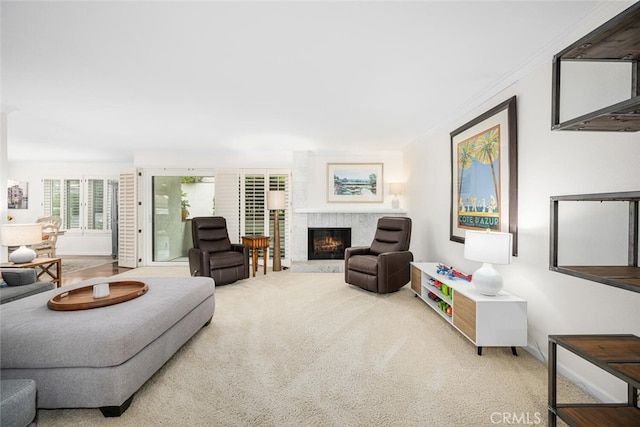 carpeted living room featuring a premium fireplace and crown molding
