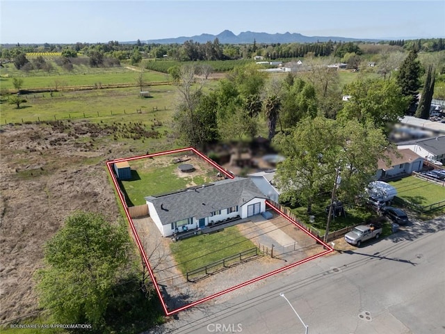 birds eye view of property with a rural view and a mountain view