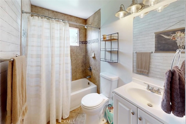 full bath with shower / tub combo, toilet, vanity, and tile patterned floors