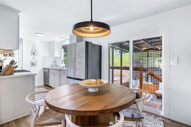 28383 Shady Oaks Rd, Clovis, CA 93619 - dining space featuring a wealth of natural light, light wood finished floors, and baseboards