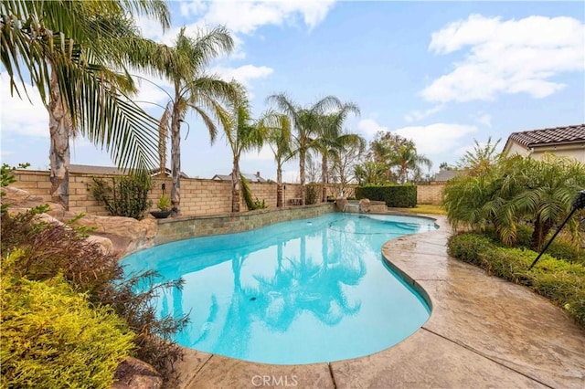 view of swimming pool featuring a fenced backyard and a fenced in pool