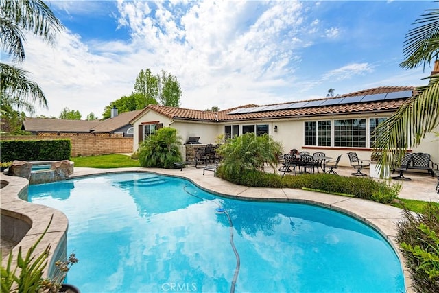 view of pool with a patio, a fenced in pool, fence private yard, and an in ground hot tub