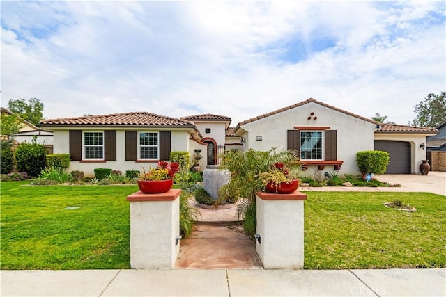mediterranean / spanish-style home featuring stucco siding, a front lawn, driveway, and a garage