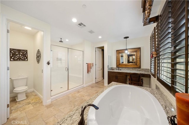 full bathroom featuring visible vents, toilet, baseboards, a garden tub, and a stall shower