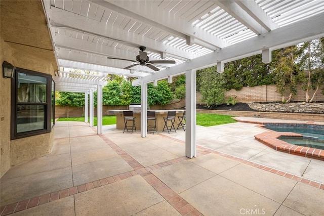 view of patio / terrace featuring a fenced backyard, a pergola, outdoor dry bar, ceiling fan, and an in ground hot tub