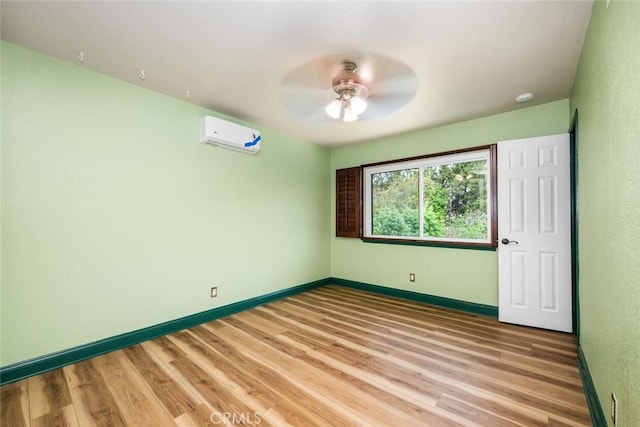 4805 Via Amante, Yorba Linda, CA 92886 - spare room featuring a wall unit AC, ceiling fan, light wood-style floors, and baseboards