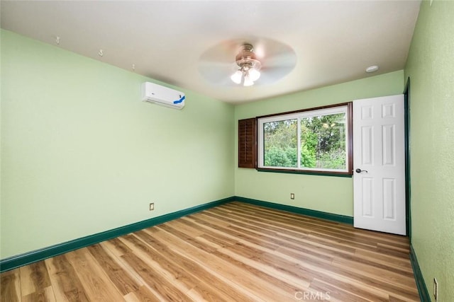 4805 Via Amante, Yorba Linda, CA 92886 - empty room featuring a wall unit AC, ceiling fan, and light wood-style floors