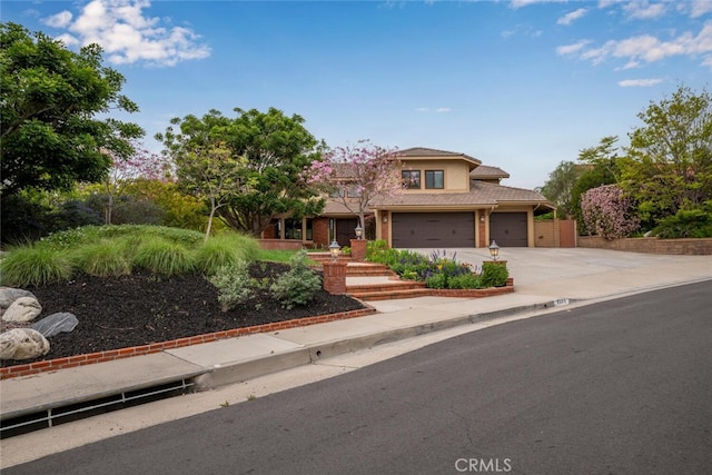 4805 Via Amante, Yorba Linda, CA 92886 - view of front of house featuring concrete driveway, a tiled roof, and an attached garage
