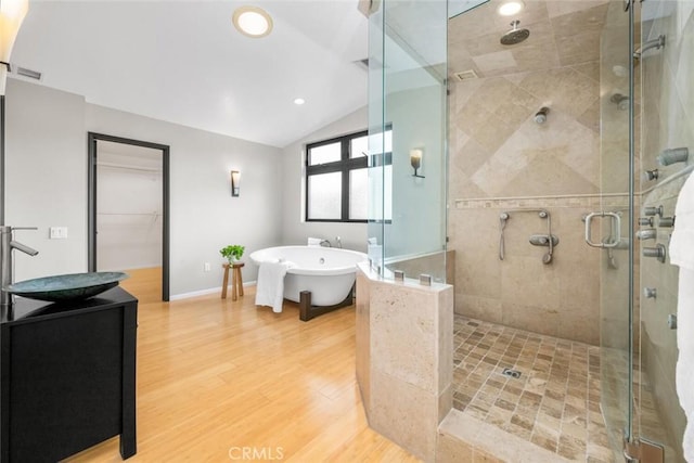 4805 Via Amante, Yorba Linda, CA 92886 - full bathroom with a stall shower, a freestanding bath, wood finished floors, lofted ceiling, and vanity