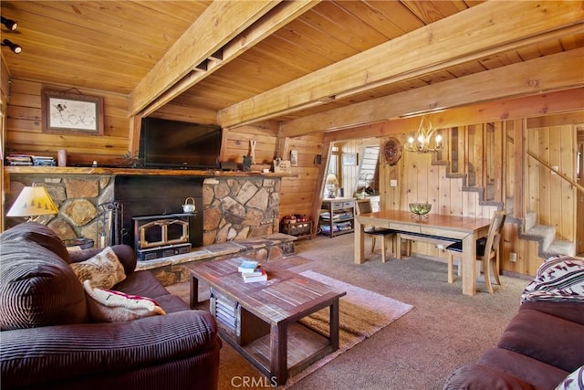 living room with stairway, carpet flooring, wood walls, and wood ceiling