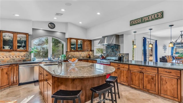 73950 22nd Ave, Desert Hot Springs, CA 92241 - kitchen featuring brown cabinets, a sink, wall chimney exhaust hood, stainless steel dishwasher, and visible vents