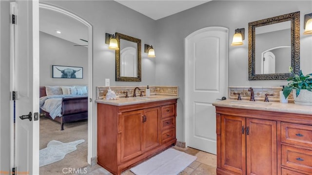 73950 22nd Ave, Desert Hot Springs, CA 92241 - bathroom with ensuite bath, tasteful backsplash, two vanities, and a sink