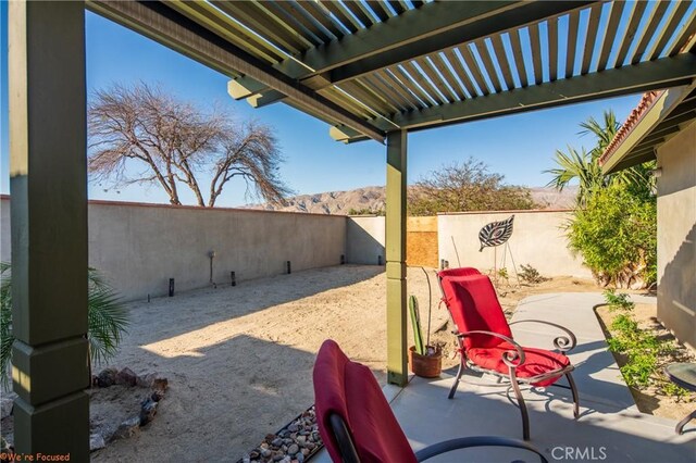 73950 22nd Ave, Desert Hot Springs, CA 92241 - view of patio with a mountain view, a pergola, and a fenced backyard
