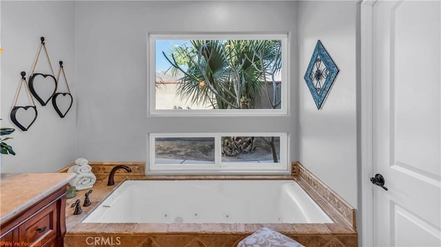 73950 22nd Ave, Desert Hot Springs, CA 92241 - full bathroom featuring a wealth of natural light, vanity, and a whirlpool tub