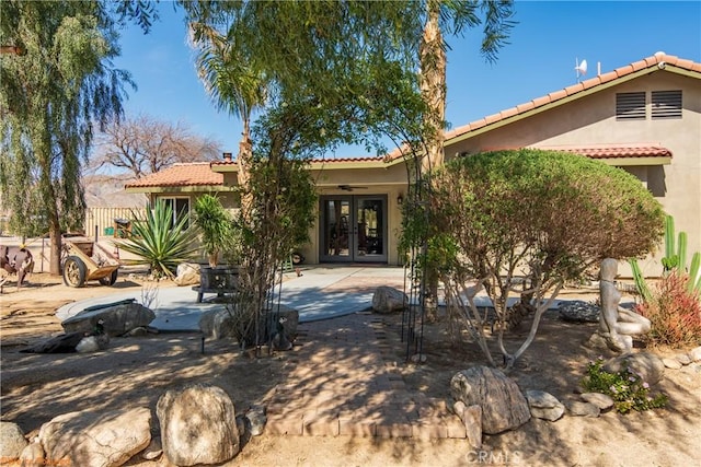 73950 22nd Ave, Desert Hot Springs, CA 92241 - view of front facade with stucco siding, french doors, and a tiled roof