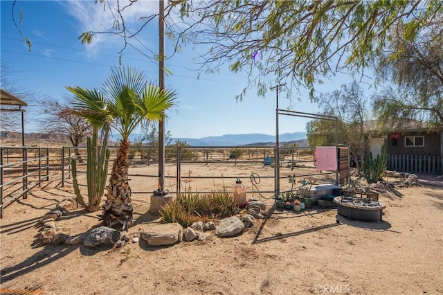 73950 22nd Ave, Desert Hot Springs, CA 92241 - view of yard with a rural view, a mountain view, and an exterior structure