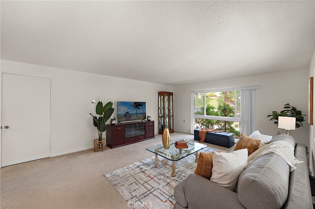 174 Avenida Majorca Unit A, Laguna Woods, CA 92637 - carpeted living room featuring a textured ceiling