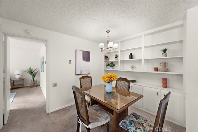 174 Avenida Majorca Unit A, Laguna Woods, CA 92637 - dining space with a chandelier, a textured ceiling, and light carpet