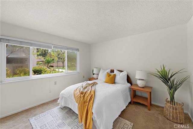 174 Avenida Majorca Unit A, Laguna Woods, CA 92637 - bedroom with a textured ceiling, carpet flooring, and baseboards