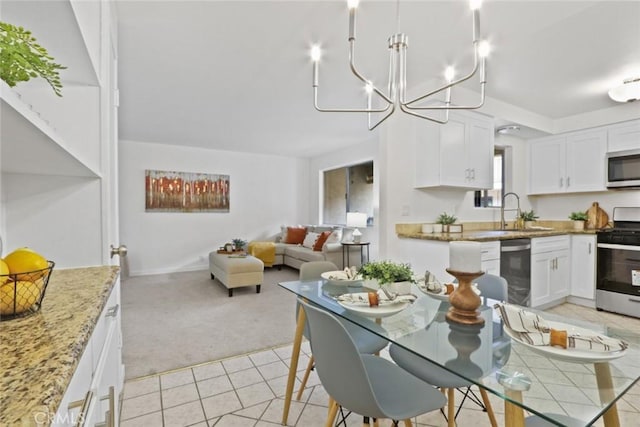 2501 W Redondo Beach Blvd Unit 238, Gardena, CA 90249 - dining area with light carpet, an inviting chandelier, and light tile patterned floors