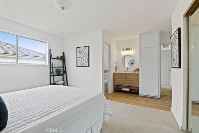 2501 W Redondo Beach Blvd Unit 238, Gardena, CA 90249 - bedroom with light colored carpet, a sink, visible vents, and ensuite bathroom