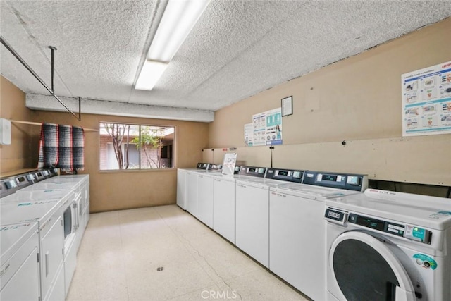 2501 W Redondo Beach Blvd Unit 238, Gardena, CA 90249 - shared laundry area featuring light floors, washer and dryer, and a textured ceiling