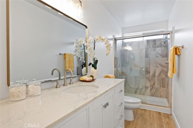 2501 W Redondo Beach Blvd Unit 238, Gardena, CA 90249 - full bathroom with a shower stall, toilet, vanity, and wood finished floors