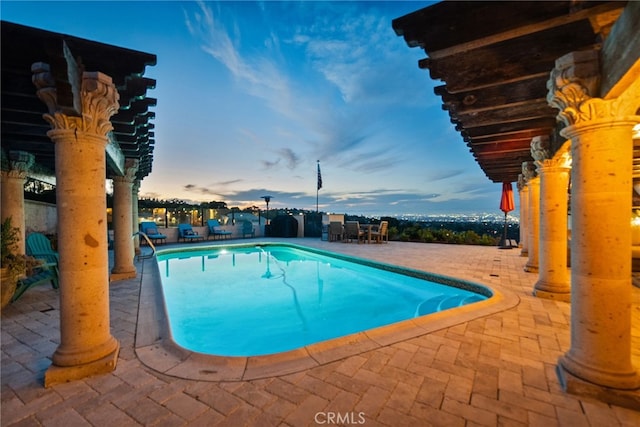 view of swimming pool with a fenced in pool and a patio