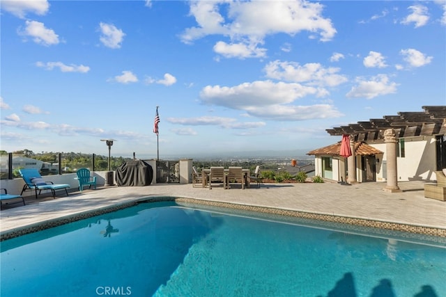 pool featuring a pergola and a patio