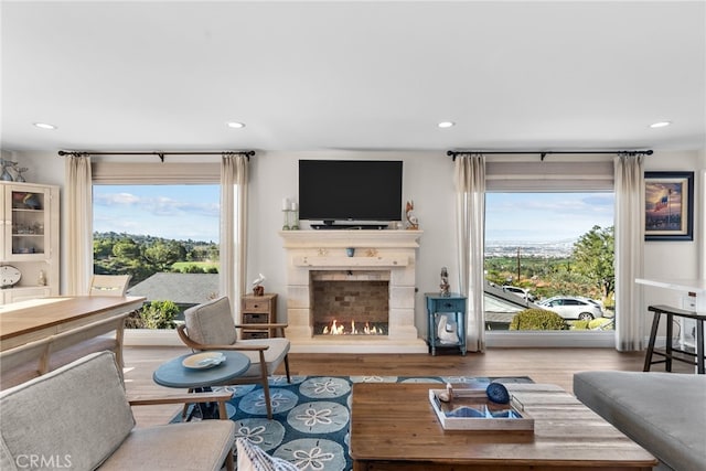 27361 Rainbow Ridge Rd, Palos Verdes Peninsula, CA 90274 - living room featuring plenty of natural light, recessed lighting, a tile fireplace, and wood finished floors