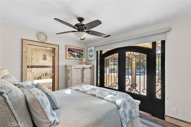 bedroom with visible vents, access to exterior, a ceiling fan, connected bathroom, and french doors