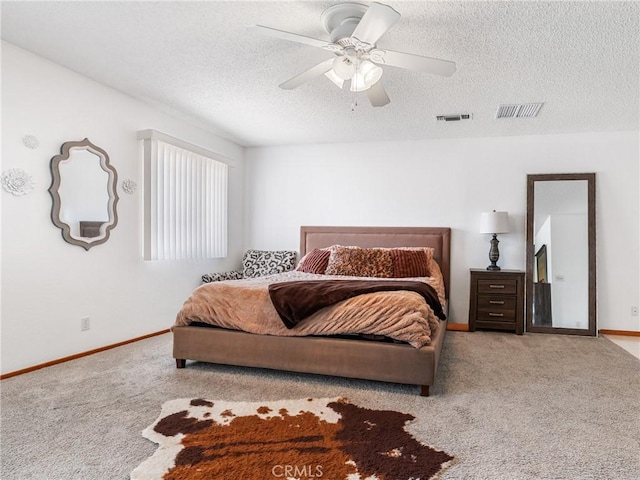 904 Pinon Dr, Barstow, CA 92311 - bedroom featuring carpet flooring, a textured ceiling, baseboards, and a ceiling fan