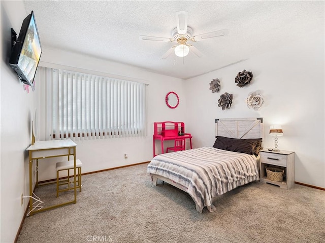904 Pinon Dr, Barstow, CA 92311 - bedroom with carpet floors, baseboards, a textured ceiling, and a ceiling fan