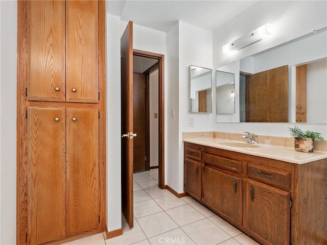 904 Pinon Dr, Barstow, CA 92311 - bathroom with tile patterned floors and vanity
